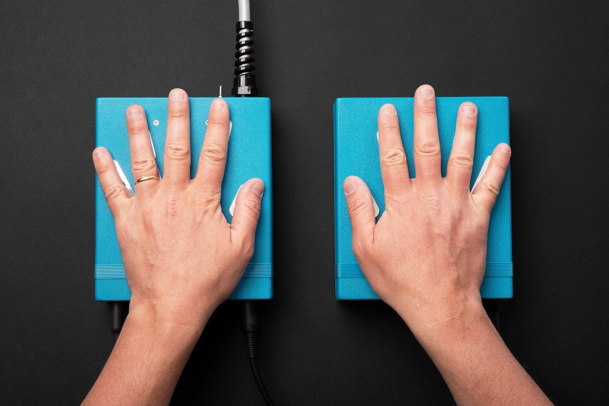 Hands resting on aura camera hand sensors